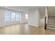 Bright living room with large windows and hardwood floors at 6322 Loraine Dr, Brownsburg, IN 46112