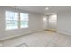 Bright living room featuring neutral gray walls and hardwood flooring at 6322 Loraine Dr, Brownsburg, IN 46112