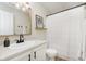 Stylish bathroom with white cabinets, black hardware, and a decorative gold-framed mirror at 6615 Rushing, Noblesville, IN 46062