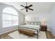 Serene bedroom with large arched window, vaulted ceiling, and stylish decor at 6615 Rushing, Noblesville, IN 46062