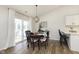 Cozy dining area with table, chairs, and sliding door to patio at 6615 Rushing, Noblesville, IN 46062