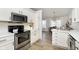 Contemporary kitchen with stainless steel appliances and white cabinetry at 6615 Rushing, Noblesville, IN 46062