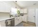 Bright kitchen with white cabinets, stainless steel sink, and modern appliances at 6615 Rushing, Noblesville, IN 46062