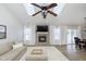 Bright living room with vaulted ceilings, fireplace, and neutral decor at 6615 Rushing, Noblesville, IN 46062