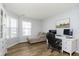 Modern office features two windows, a white desk, and comfortable chaise lounge at 6615 Rushing, Noblesville, IN 46062
