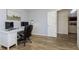 Bright office space with a large desk, comfortable chair, and wood-look flooring at 6615 Rushing, Noblesville, IN 46062