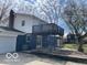 Back exterior view of home featuring a spacious deck, offering a perfect outdoor entertaining area at 810 Kendale Ct, Indianapolis, IN 46234