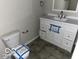 Clean bathroom with white vanity and tile flooring at 810 Kendale Ct, Indianapolis, IN 46234