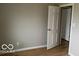 Simple bedroom with hardwood floors and neutral walls at 810 Kendale Ct, Indianapolis, IN 46234