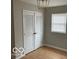 Bright bedroom with light walls, wood floors, and a closet at 810 Kendale Ct, Indianapolis, IN 46234