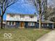 Charming two-story home featuring a neatly kept lawn, inviting curb appeal and beautiful architectural details at 810 Kendale Ct, Indianapolis, IN 46234