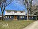 Charming two-story home featuring a neatly kept lawn, inviting curb appeal and beautiful architectural details at 810 Kendale Ct, Indianapolis, IN 46234