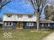 Charming two-story home featuring a neatly kept lawn, inviting curb appeal and beautiful architectural details at 810 Kendale Ct, Indianapolis, IN 46234