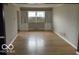 Spacious living room with hardwood floors and built-in shelving at 810 Kendale Ct, Indianapolis, IN 46234