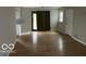 Open living room with hardwood floors and access to the backyard at 810 Kendale Ct, Indianapolis, IN 46234