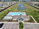 Aerial view of community pool, pond and homes at 8798 Walker St, Fortville, IN 46040