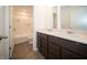 Bathroom featuring double sink vanity and a bathtub with shower at 8798 Walker St, Fortville, IN 46040