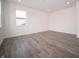Bedroom showcasing an abundance of natural light with wood-style flooring and neutral walls at 8798 Walker St, Fortville, IN 46040