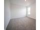 Bright bedroom featuring a window and neutral carpet and walls at 8798 Walker St, Fortville, IN 46040