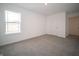 Bedroom featuring a bright window, neutral carpet and walls and a closet at 8798 Walker St, Fortville, IN 46040