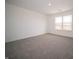 Bright bedroom featuring neutral carpet, light walls, and a large window overlooking the outdoors at 8798 Walker St, Fortville, IN 46040