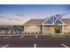Community pool house and parking lot at dusk at 8798 Walker St, Fortville, IN 46040