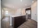 Well-lit kitchen island featuring stainless steel appliances and seamlessly connected to the inviting living room at 8798 Walker St, Fortville, IN 46040