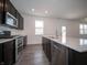 Well-equipped kitchen with stainless steel appliances and quartz countertops, ideal for cooking and entertaining at 8798 Walker St, Fortville, IN 46040