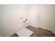 Laundry room featuring wood look flooring and wire shelving at 8798 Walker St, Fortville, IN 46040