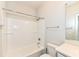 Bathroom featuring white tile, tub, and shower at 9217 Hawley Dr, Indianapolis, IN 46216
