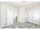 Bedroom features gray carpet, open doorway, and double door closet at 9217 Hawley Dr, Indianapolis, IN 46216