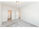 Bedroom with gray carpet, walk-in closet, and view of another bedroom through doorway at 9217 Hawley Dr, Indianapolis, IN 46216