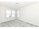 Bedroom with gray carpet, two windows, and window blinds at 9217 Hawley Dr, Indianapolis, IN 46216