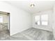Bedroom features gray carpet, natural light, and open doorway at 9217 Hawley Dr, Indianapolis, IN 46216