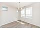 Inviting dining room with stylish chandelier, hardwood floors, and a large window at 9217 Hawley Dr, Indianapolis, IN 46216
