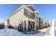 Modern two-story townhome with gray siding, stone accents, and a black fence at 9217 Hawley Dr, Indianapolis, IN 46216