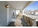 Wooden front porch with railing, overlooking a residential street at 1108 Rosner Dr, Indianapolis, IN 46224