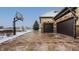 Three-car garage with stamped concrete driveway and basketball court at 11281 Golden Bear Way, Noblesville, IN 46060