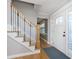 Bright entryway with staircase and hardwood floors at 11421 Haverstick Rd, Carmel, IN 46033