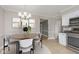 Kitchen with white cabinets and stainless steel appliances at 11421 Haverstick Rd, Carmel, IN 46033