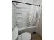 Bathroom with bathtub, shower, and floral curtain at 1256 Kappes St, Indianapolis, IN 46221