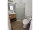 Clean bathroom with corner shower and wood-look floors at 1256 Kappes St, Indianapolis, IN 46221