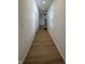 Long hallway with light wood flooring at 1256 Kappes St, Indianapolis, IN 46221