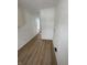 Clean hallway with light walls and vinyl flooring at 1256 Kappes St, Indianapolis, IN 46221
