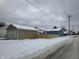 Newly renovated blue house with new garage and fence at 1256 Kappes St, Indianapolis, IN 46221