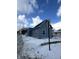 Side view of blue house on a snow-covered street at 1256 Kappes St, Indianapolis, IN 46221