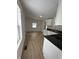 Open concept kitchen and living area with light vinyl flooring at 1256 Kappes St, Indianapolis, IN 46221