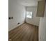 Laundry room with vinyl flooring and a window at 1256 Kappes St, Indianapolis, IN 46221