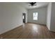 Spacious living room featuring hardwood floors and ceiling fan at 1256 Kappes St, Indianapolis, IN 46221