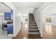 Staircase with carpeted steps leading to the second floor at 138 Fairway Dr, Indianapolis, IN 46260